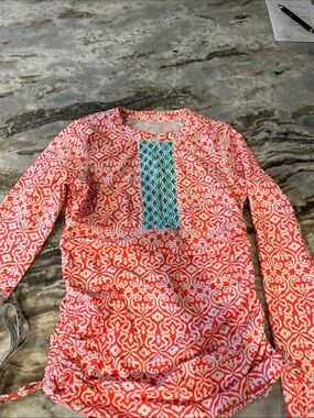 Coral and White Patterned Sun Protection Top with Teal Accents